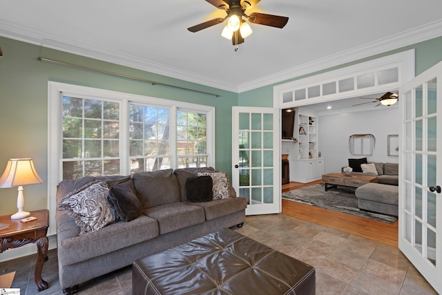 living room with wood-type flooring, french doors, ceiling fan, and crown molding