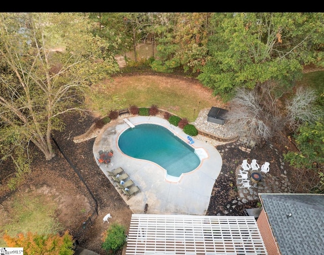 view of swimming pool featuring a patio