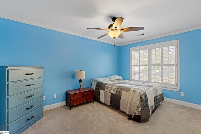 carpeted bedroom with ceiling fan and crown molding