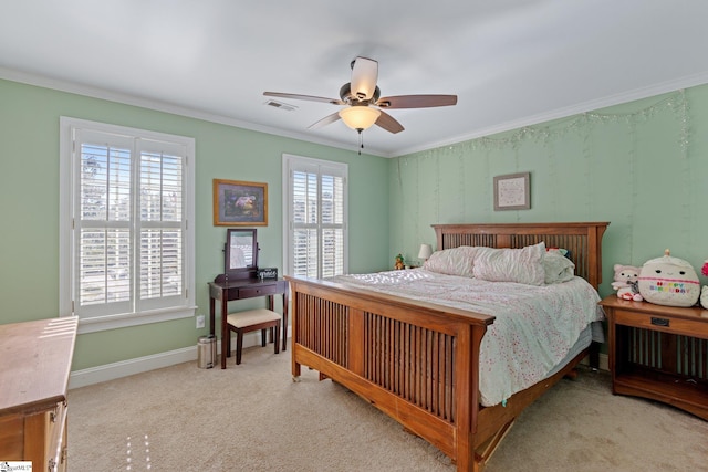 carpeted bedroom with multiple windows, ceiling fan, and crown molding