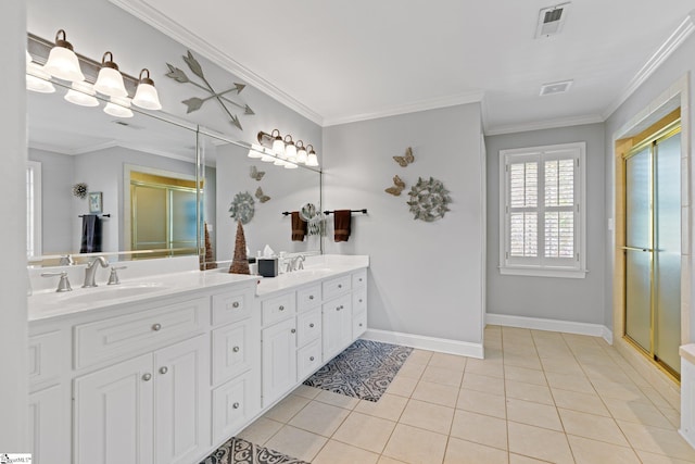 bathroom featuring ornamental molding, vanity, tile patterned floors, and a shower with door