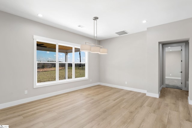 unfurnished dining area with light hardwood / wood-style flooring