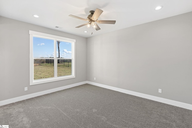 empty room featuring ceiling fan and carpet floors