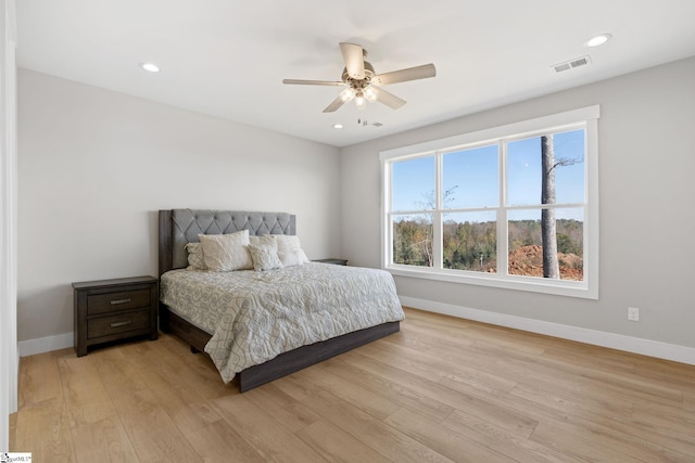 bedroom featuring light wood-type flooring and ceiling fan