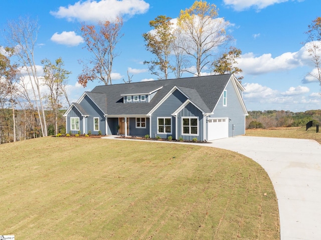 view of front facade with a front lawn and a garage