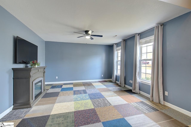 living room with ceiling fan and carpet floors