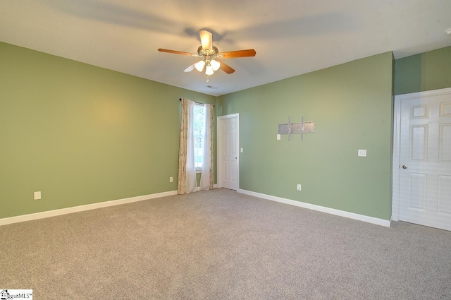 225 Worcester Ln, Easley, SC 29642 - spare room featuring light carpet, baseboards, and a ceiling fan