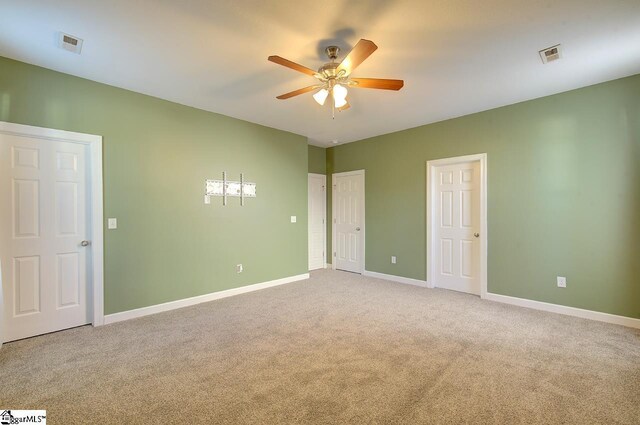 225 Worcester Ln, Easley, SC 29642 - unfurnished bedroom featuring carpet, baseboards, and a ceiling fan