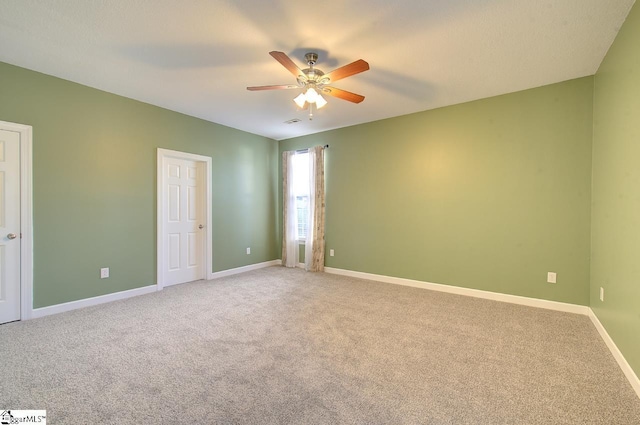225 Worcester Ln, Easley, SC 29642 - unfurnished bedroom featuring light colored carpet, baseboards, and a ceiling fan