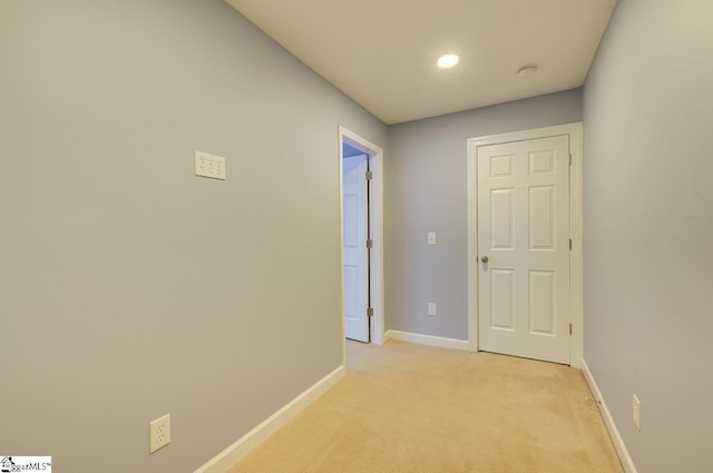 hallway with light carpet