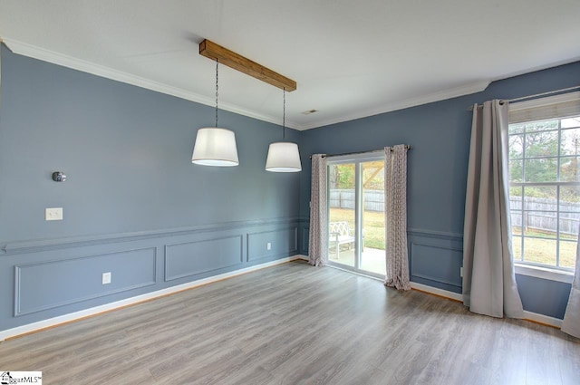 225 Worcester Ln, Easley, SC 29642 - spare room with a decorative wall, wood finished floors, crown molding, and wainscoting