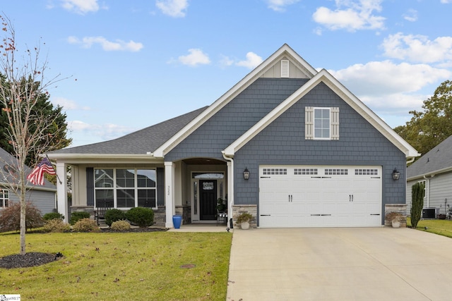 craftsman inspired home featuring central air condition unit and a front yard