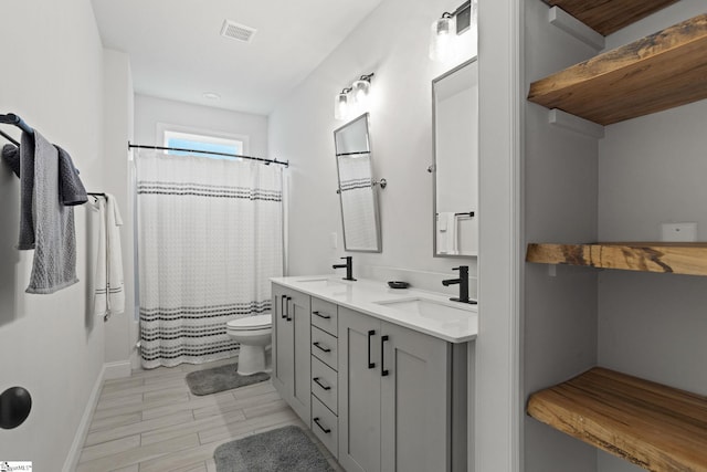 bathroom featuring walk in shower, wood-type flooring, toilet, and vanity