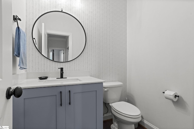 bathroom with vanity and toilet