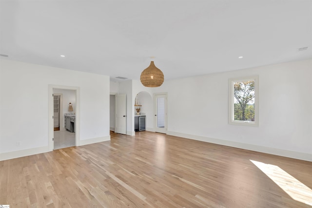 unfurnished living room featuring light hardwood / wood-style floors