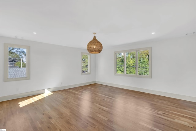 spare room with light hardwood / wood-style flooring