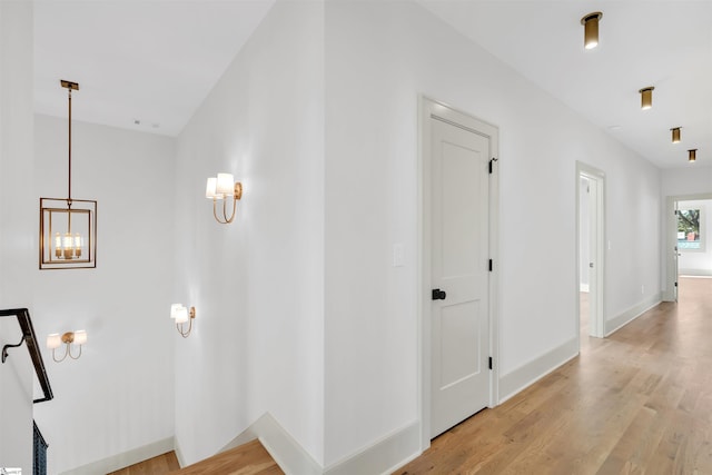 hall with light hardwood / wood-style flooring