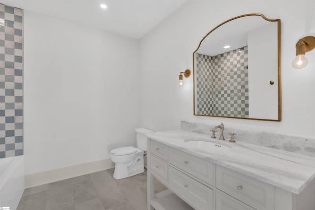 bathroom featuring vanity, tile patterned floors, and toilet