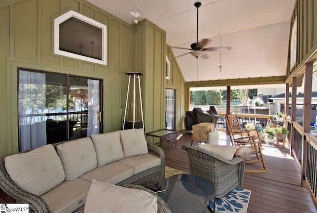 sunroom / solarium with lofted ceiling and ceiling fan