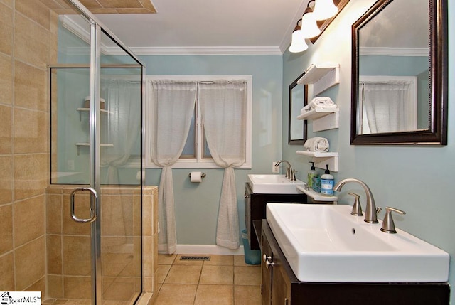 bathroom with vanity, tile patterned floors, an enclosed shower, and crown molding