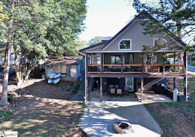 back of house with a patio