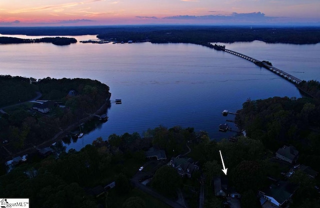 aerial view at dusk with a water view