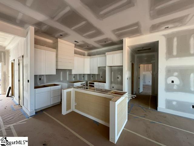 kitchen featuring white cabinets and a kitchen island