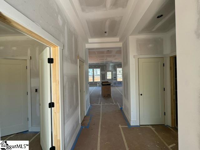 hall with a tray ceiling