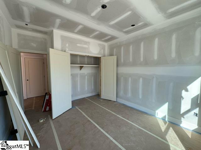 unfurnished bedroom with a closet