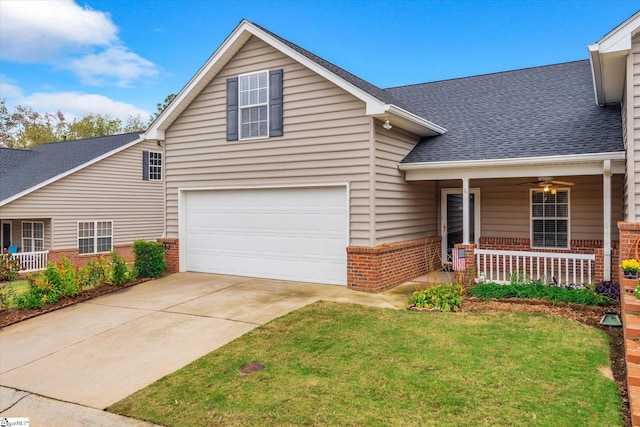 front facade with a garage, a porch, and a front yard