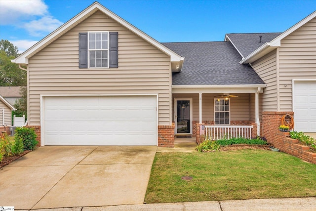 view of front property with a garage, a porch, and a front yard