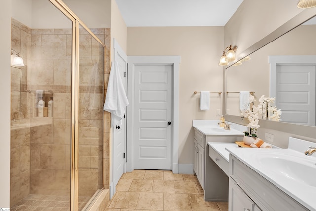 bathroom with an enclosed shower, tile patterned floors, and vanity