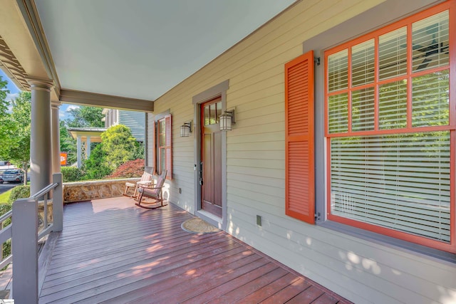 wooden terrace with a porch