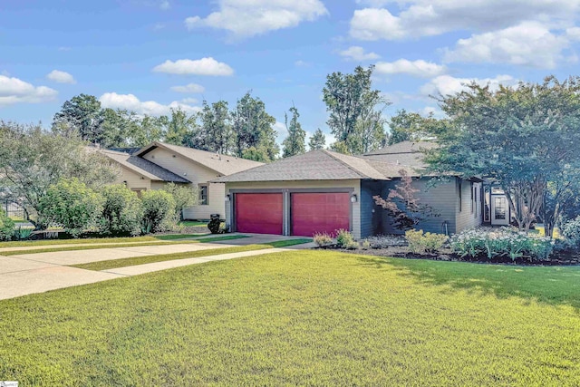 single story home with a garage and a front lawn