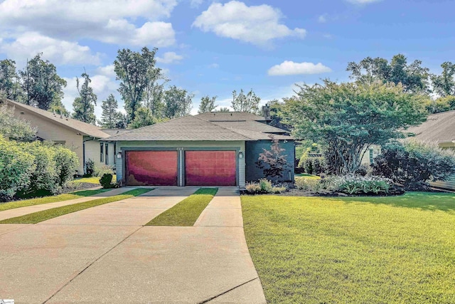 single story home featuring a front yard and a garage