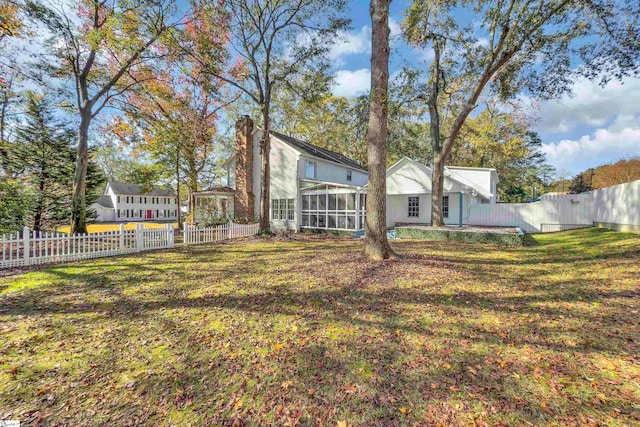 view of yard with a sunroom