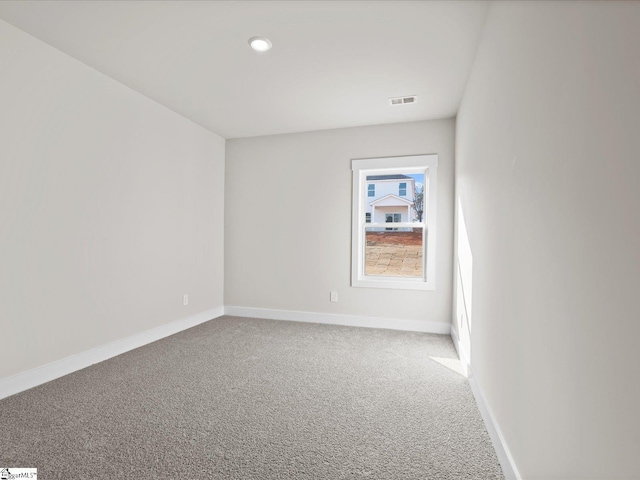 unfurnished room with carpet flooring