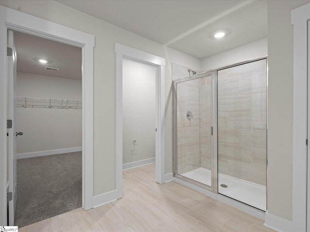 bathroom with an enclosed shower