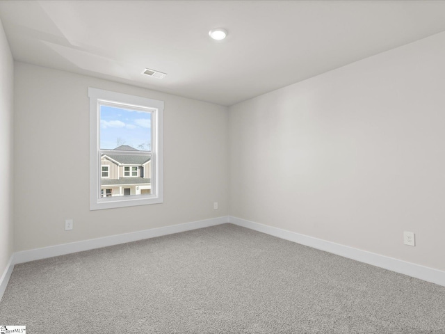 unfurnished room with carpet floors