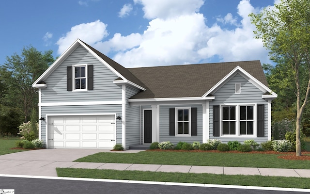 view of front of property featuring a garage and a front yard