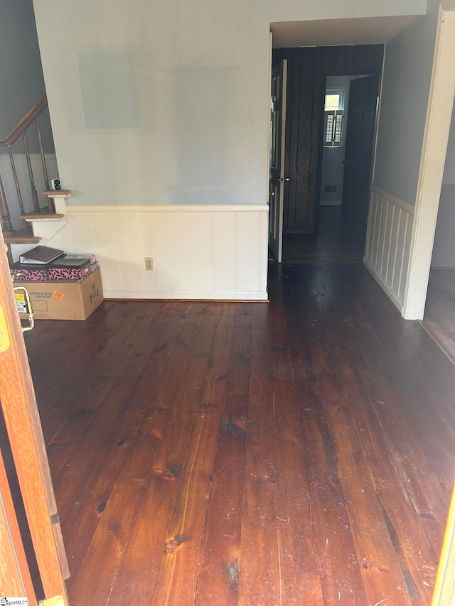 spare room with dark hardwood / wood-style floors