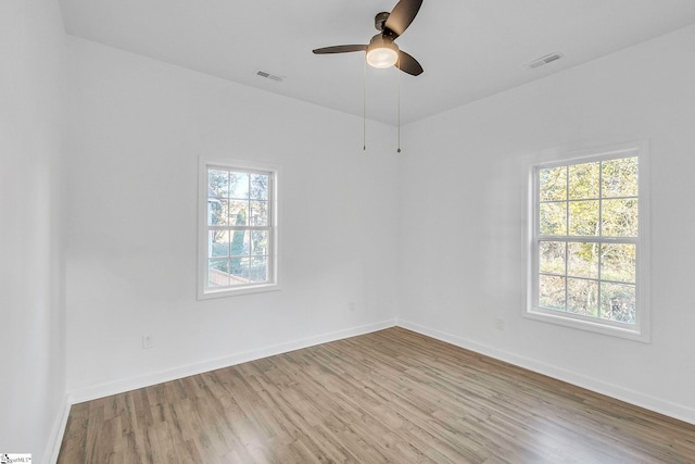 unfurnished room featuring ceiling fan and light hardwood / wood-style flooring