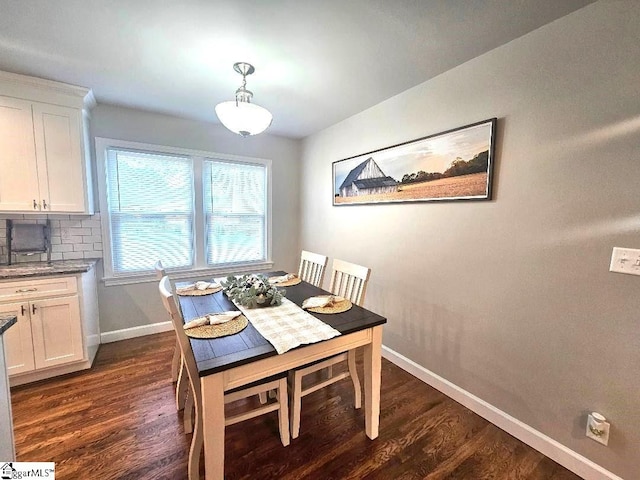 dining area featuring dark hardwood / wood-style floors