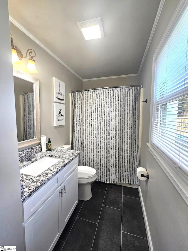 bathroom with tile patterned floors, ornamental molding, a shower with curtain, vanity, and toilet