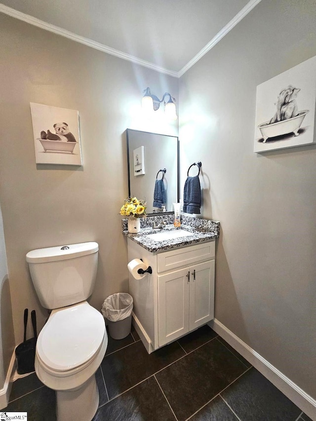 bathroom featuring ornamental molding, tile patterned flooring, vanity, and toilet