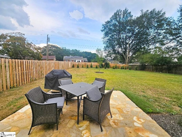 view of patio featuring a grill