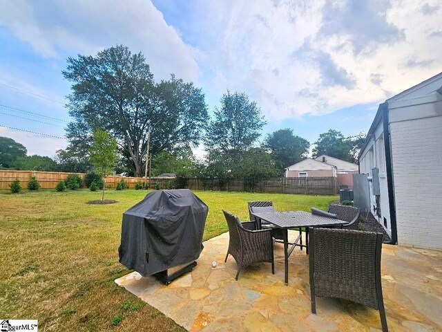 view of patio with a grill