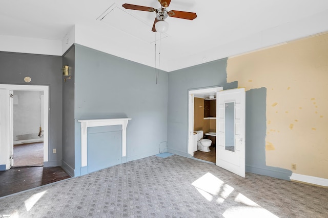 unfurnished living room with dark colored carpet and ceiling fan