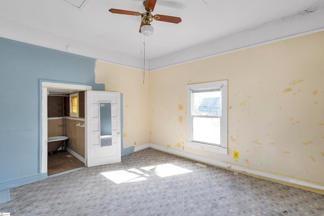 315 Poole St, Woodruff, SC 29388 - unfurnished bedroom with carpet flooring, ceiling fan, and connected bathroom