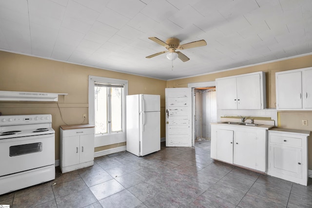 315 Poole St, Woodruff, SC 29388 - kitchen with sink, ceiling fan, white appliances, range hood, and white cabinets